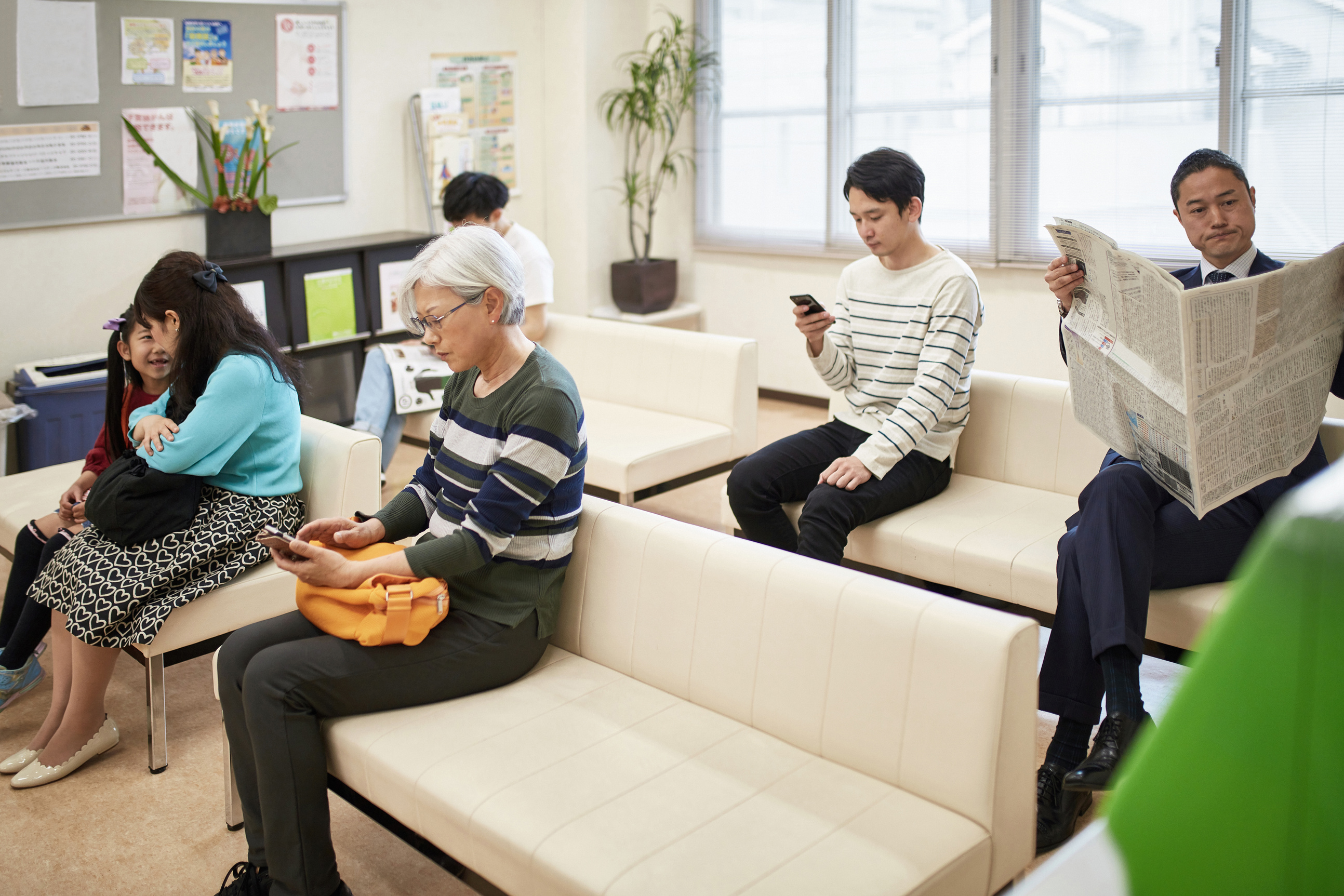 Patients Sitting in Hospital Waiting Room